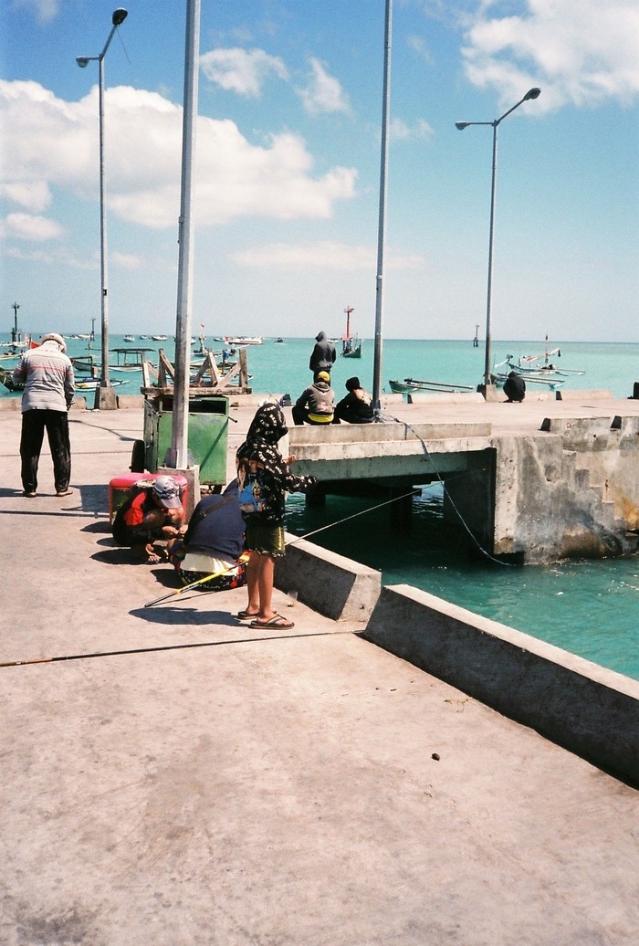 Kids fishing at Jimbaran fish market, Bali 2018